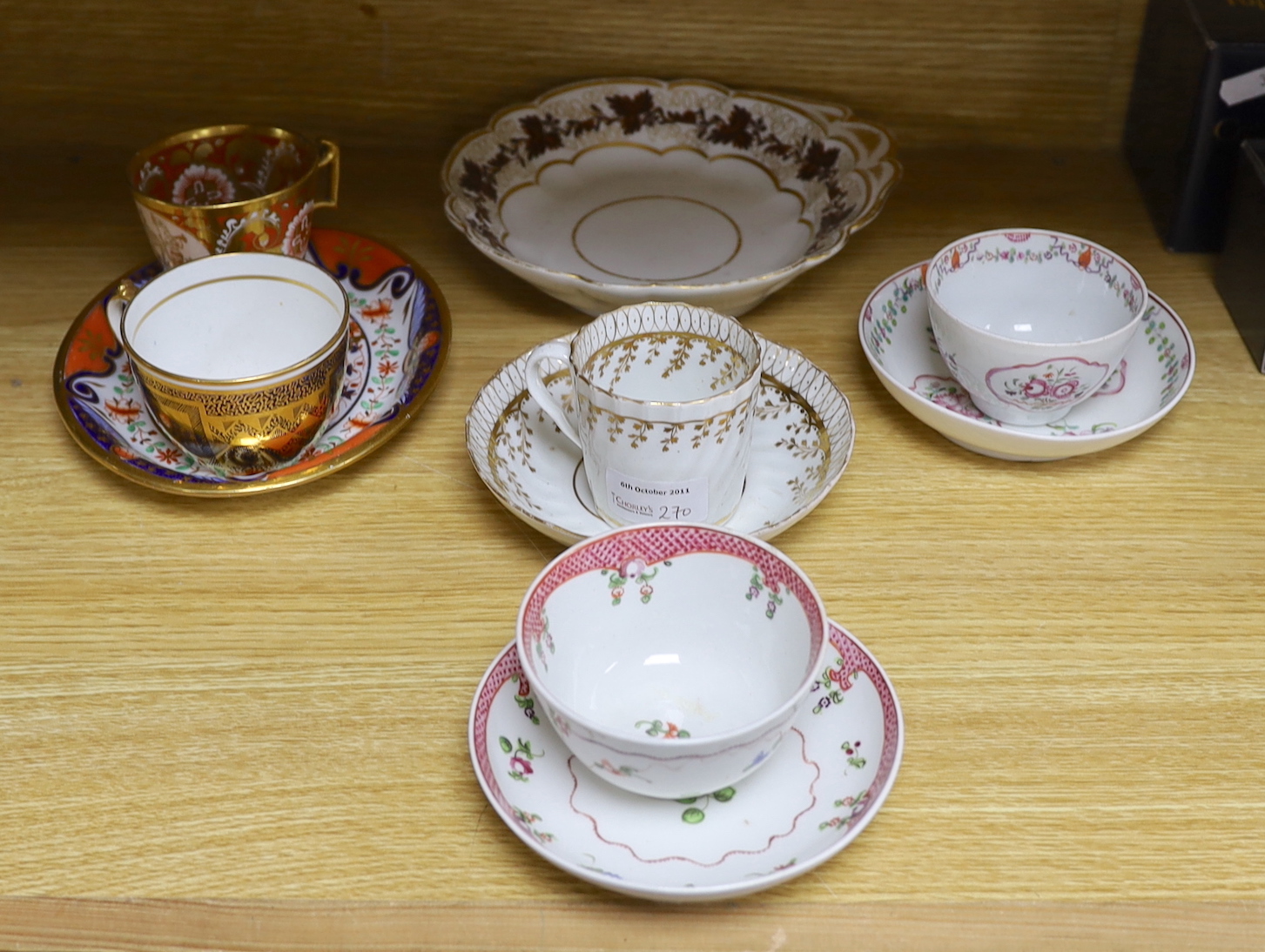 A Herculaneum teapot stand painted in Imari style, a Herculaneum coffee cup painted with the arms of Liverpool Corporation, a Flight Barr shell shaped dish painted with brown leaves, a Miles Manson cup highly gilded on a